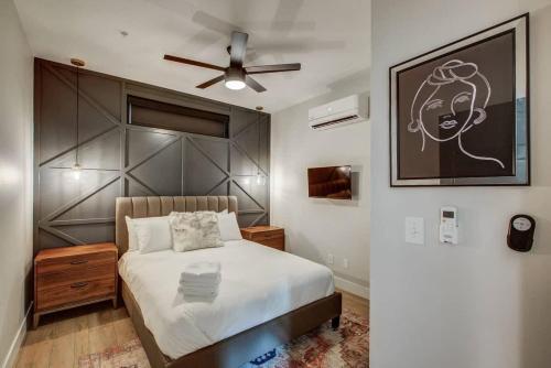 a bedroom with a bed and a ceiling fan at Chic Tennyson St Retreat - Walk to Shops & Cafes in Denver
