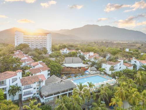 an aerial view of a resort with a pool and buildings at Decameron Galeon - All Inclusive in Santa Marta