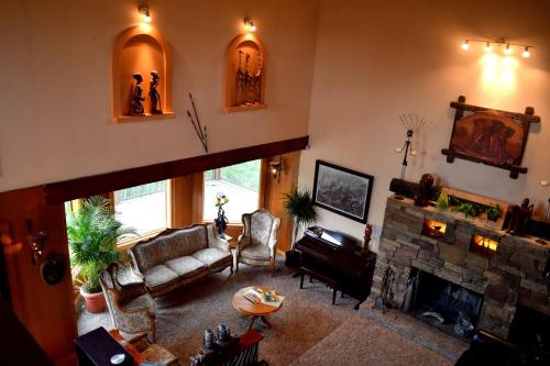 a living room with a couch and a fireplace at South Africa House Guest Lodge in Wainwright