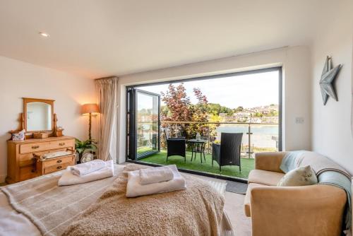 a bedroom with a bed and a large window at 3 Bed in Bideford oc-79552 in Bideford