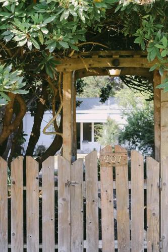 a wooden fence in front of a gazebo at Rock Rose Cottage in Trinidad