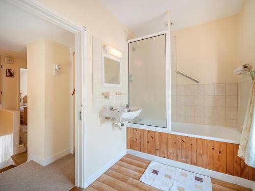a bathroom with a sink and a shower at 3 Bed in Glengarrff oc-i089 in Glengarriff