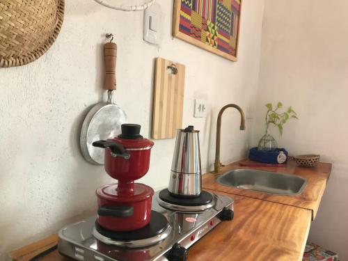 a kitchen counter with a blender and a sink at Canto Alegre Pernambuco in Goiana