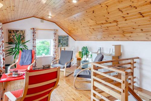 a room with chairs and a wooden ceiling at 2 Bed in Cashel oc-i223 in Moyrus