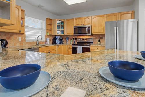 a kitchen with two blue bowls on a counter at Manatee Bay in Apollo Beach