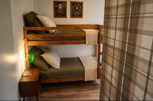 a couple of bunk beds in a room at "Chez mémé" in Locquirec