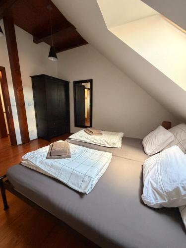 a bedroom with two mattresses on a large bed at RAST apartment house in Třebíč