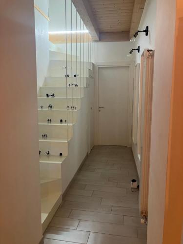 a hallway with a staircase with glass shelves at Sagittabondo in Campobasso