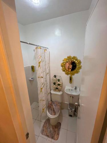 a bathroom with a toilet and a sink at Zensean Haven in General Santos