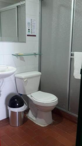 a bathroom with a toilet and a sink and a shower at Finca Hotel Caracolí I A 15 Minutos del Parque del Café in Montenegro