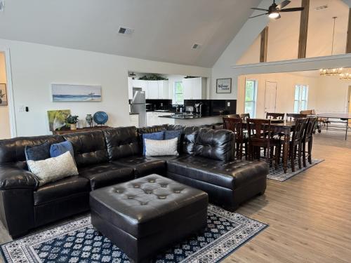 a living room with a leather couch and a table at Charming Room in Martinez in Martinez
