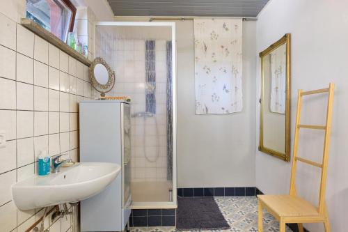 a small bathroom with a sink and a shower at Jurte Falken Nest in Eisenbach