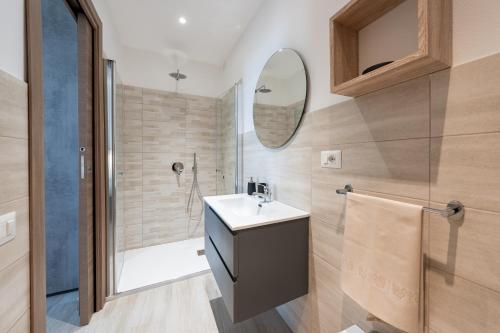 a bathroom with a sink and a shower at Raggio di Sole Ulassai in Ulassai