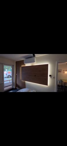 a bedroom with a bed and a large window at Apartament Słowik Lux in Rowy