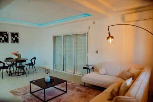 a living room with a couch and a table at Villa Domi in Antsiranana