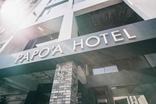 a sign on the front of a papago hotel at PAPO'A Hotel in Kaohsiung