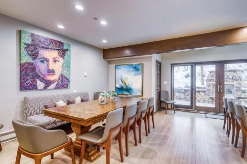 a dining room with a wooden table and chairs at Vail Ski-In Ski-Out Chalet in Vail