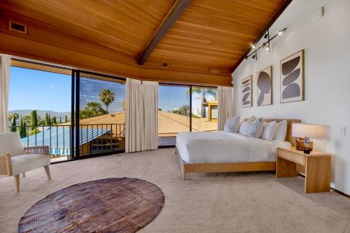 a bedroom with a bed and a large window at Via Vallarta in Los Angeles