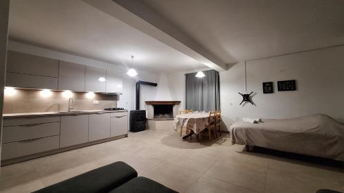 a kitchen and a living room with a bed and a table at Family friendly seaside apartments Cove Rapak, Hvar - 12779 in Gdinj