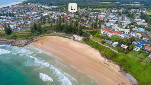 an aerial view of a beach and a city at Seaspray Views - Lifestyle Yamba in Yamba