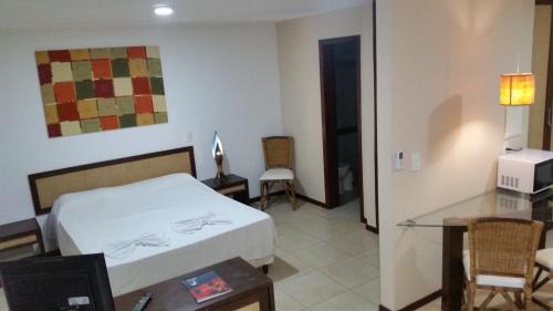 Una cama o camas en una habitación de Solar Pipa Apartments