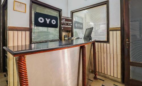 an office with a desk with a laptop on it at Hotel O Prem Chunaria in Morādābād