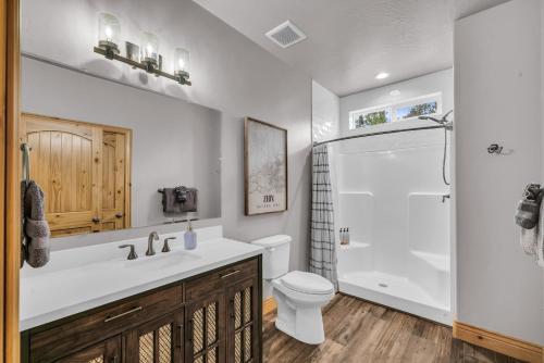 a bathroom with a sink and a toilet and a shower at East Zion Trails Retreat-Hot tub, Resort Amenities, Exceptional in Orderville