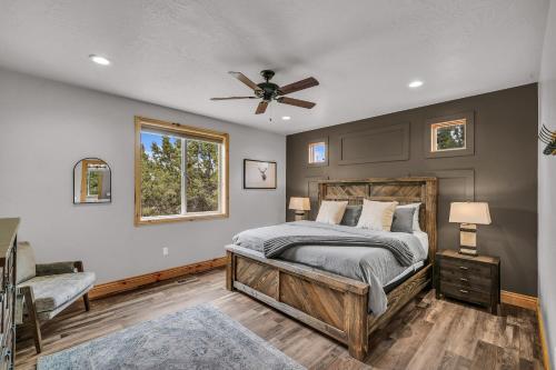 a bedroom with a bed and a ceiling fan at East Zion Trails Retreat-Hot tub, Resort Amenities, Exceptional in Orderville