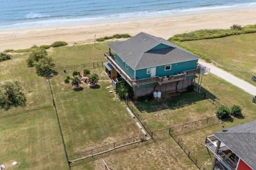 an aerial view of a house on the beach at Beachfront Fire Pit Gourmet Kitchen Views in Bolivar Peninsula