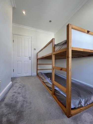 a bedroom with two bunk beds in a room at Full House - Croydon centre in Croydon