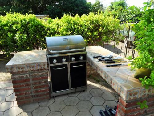 a grill sitting on top of a stone patio at Coco Cabañas and Casitas Vacation Rentals in Loreto