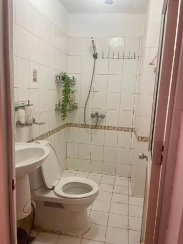 a bathroom with a toilet and a sink at Bee's House in Hanoi
