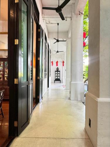 an empty hallway of a building with a ceiling at 99 The Gallery Hotel in Chiang Mai