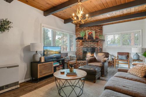 a living room with a couch and a table at Brunos Bungalow in Big Bear Lake