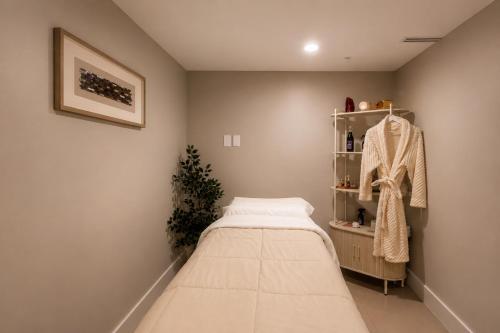 a room with a bed and a shelf at Habitat Residence in Miami