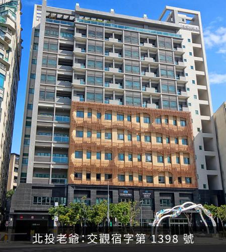 a tall building with windows in a city at Hotel Royal Beitou in Taipei