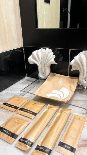 a counter with three wooden cutting boards on a counter top at Impiana Hotel Ipoh in Ipoh