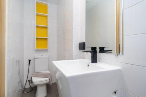 a white bathroom with a sink and a toilet at Duplex Loft 5 Pools and Gym near Nai Harn Beach- UTL B119 in Rawai Beach