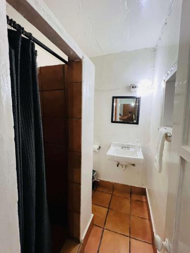 a bathroom with a sink and a mirror at #6- Rancho Meling in Camalú