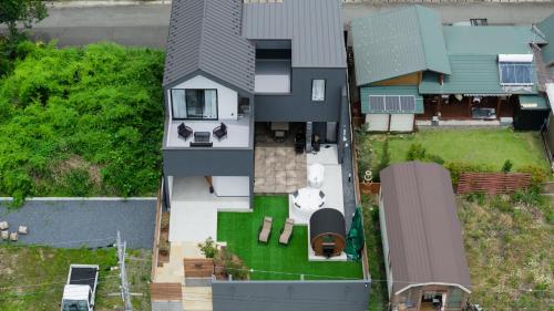 an overhead view of a house with a backyard at The Terrace MAKINO in Takashima