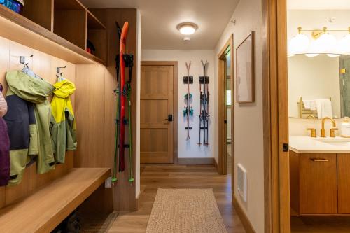 a bathroom with skis hanging on the wall at Switchback at Edelweiss in Whitefish