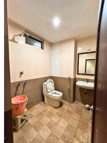 a bathroom with a toilet and a sink and a tub at HOTEL SEBAA PALACE in Kanyakumari