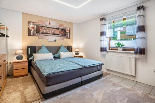 a bedroom with a bed and a window at Kastanie in Selb