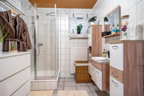 a bathroom with a shower and a sink at Kastanie in Selb