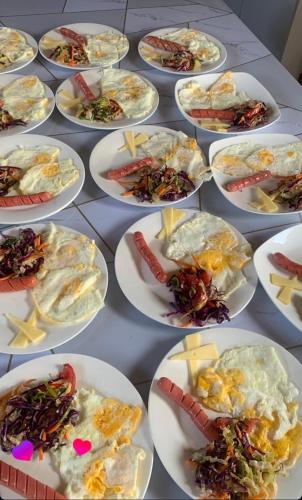a bunch of plates of food on a table at Guest House Archa in Tong