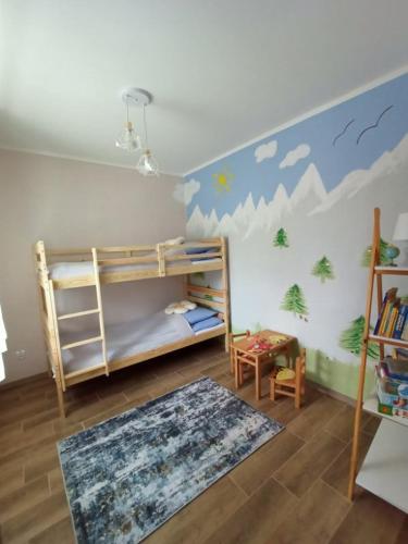 a room with two bunk beds and a rug at Dom JAMAR - apartamenty in Jastrzębia Góra