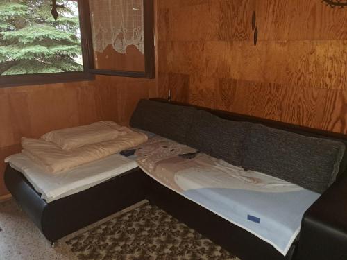 a bed in a room with two mattresses at Kemp pro karavan a stan s chatkou in Veselí nad Moravou