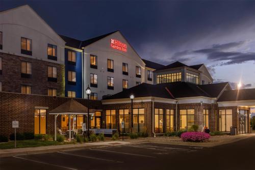 a rendering of the exterior of a hotel at night at Hilton Garden Inn Sioux Falls South in Sioux Falls