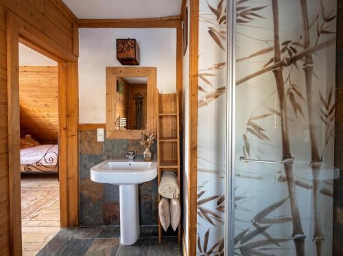 a bathroom with a sink and a shower at Golden Tatra Chalet - Fireplace, Sauna & Garden in Zakopane