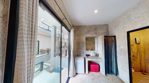 a kitchen with a sink and a counter at The Rest Hotel in Ko Larn